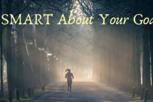 An image of a person running down a trail lined with tall trees. Text over the image reads "Be SMART about your goals." This image is attached to a post on SMART goals and SMART intentions.