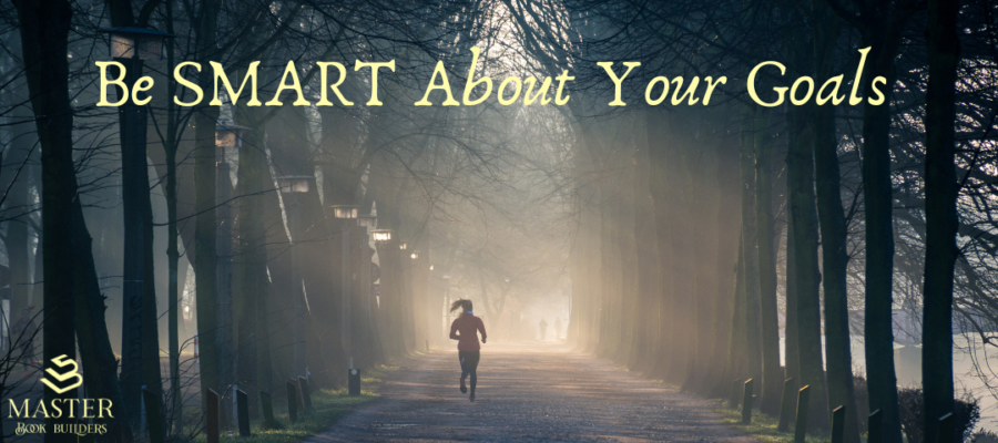An image of a person running down a trail lined with tall trees. Text over the image reads "Be SMART about your goals." This image is attached to a post on SMART goals and SMART intentions.