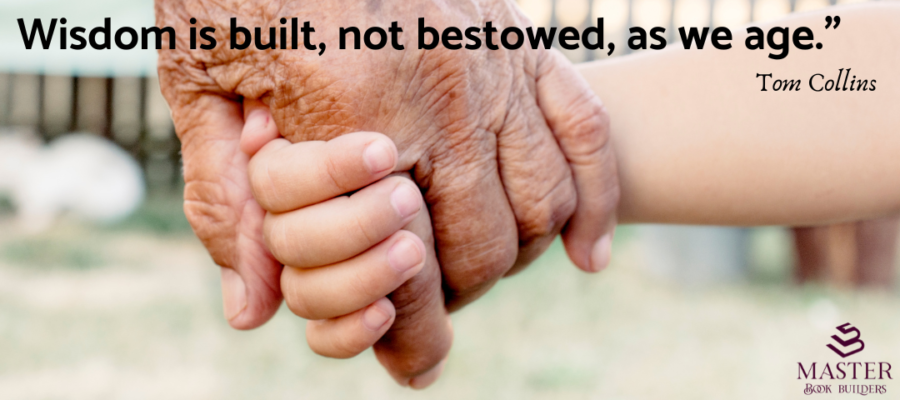 A close-up of an elderly person's hand holding a child's hand. Text over the image is a quote from Tom Collins that reads "Wisdom is built, not bestowed, as we age." The image is connected to an article on how to grow wiser as you age.