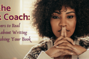 Ask the Book Coach image of a black woman sitting with her arms on a desk, fingers entwined looking straight at the camera.